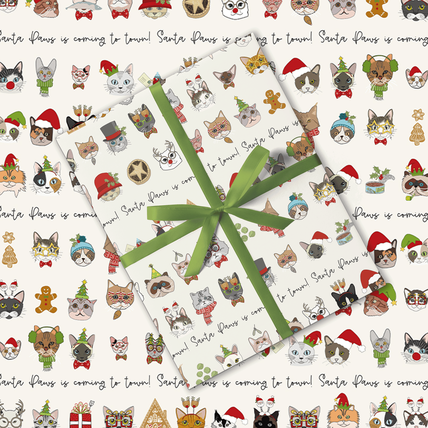 Gift wrap with Christmas-themed cat illustrations and a green ribbon.
