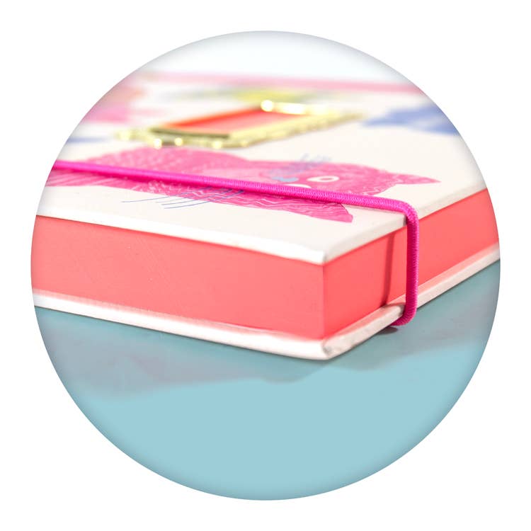 pink pages in a book with colourful cover on a white background