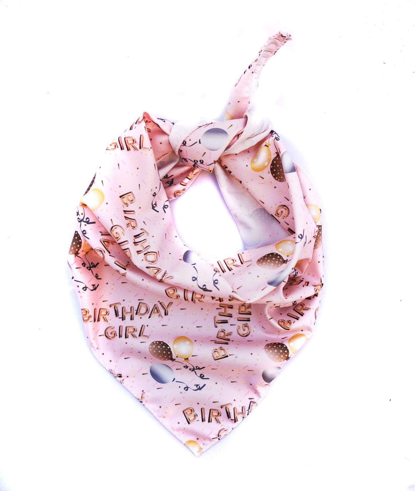 Pink dog bandana with 'Birthday Girl' text and birthday-themed designs on a white background