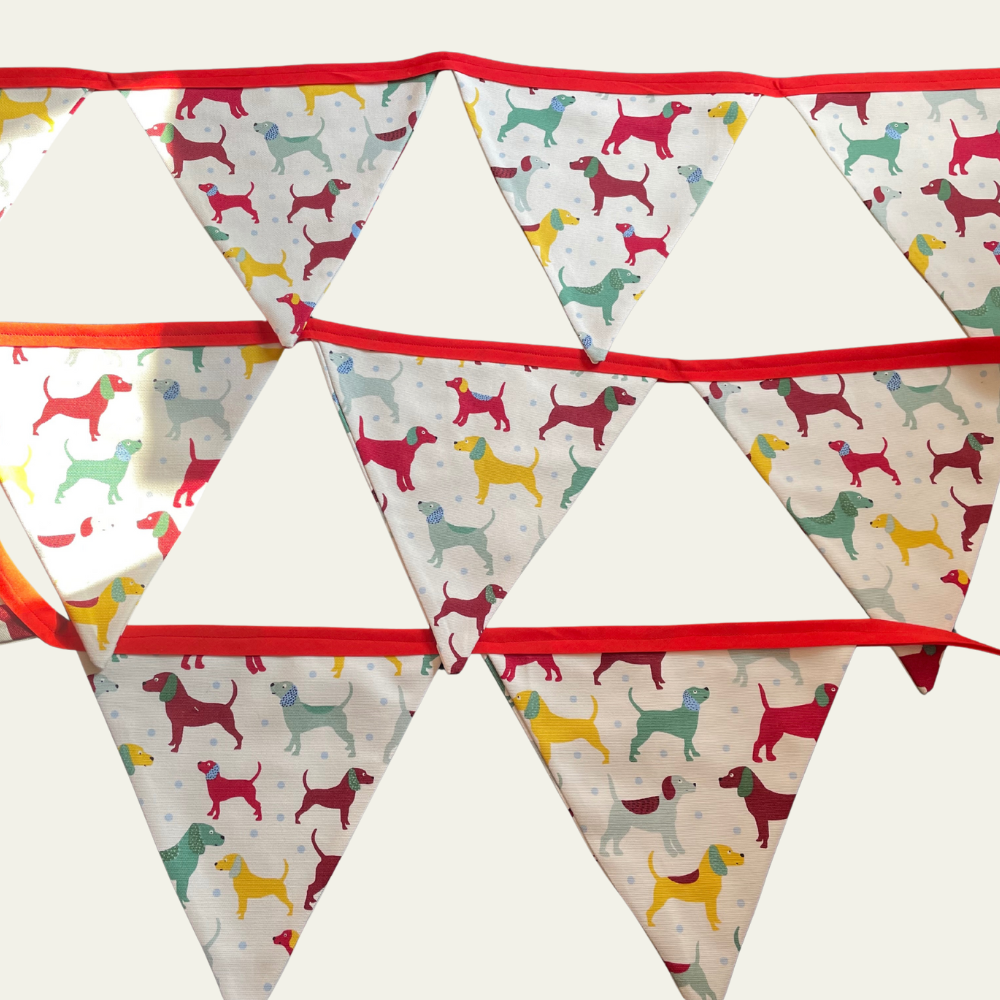 Bunting with colourful dog pattern on a white background