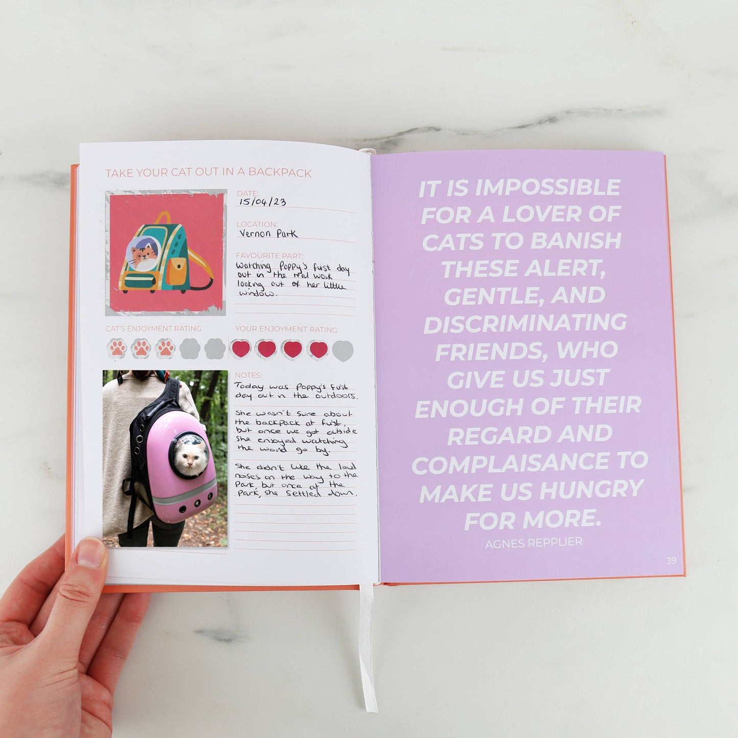 my cat journal book open on a page with photos and text about an outing