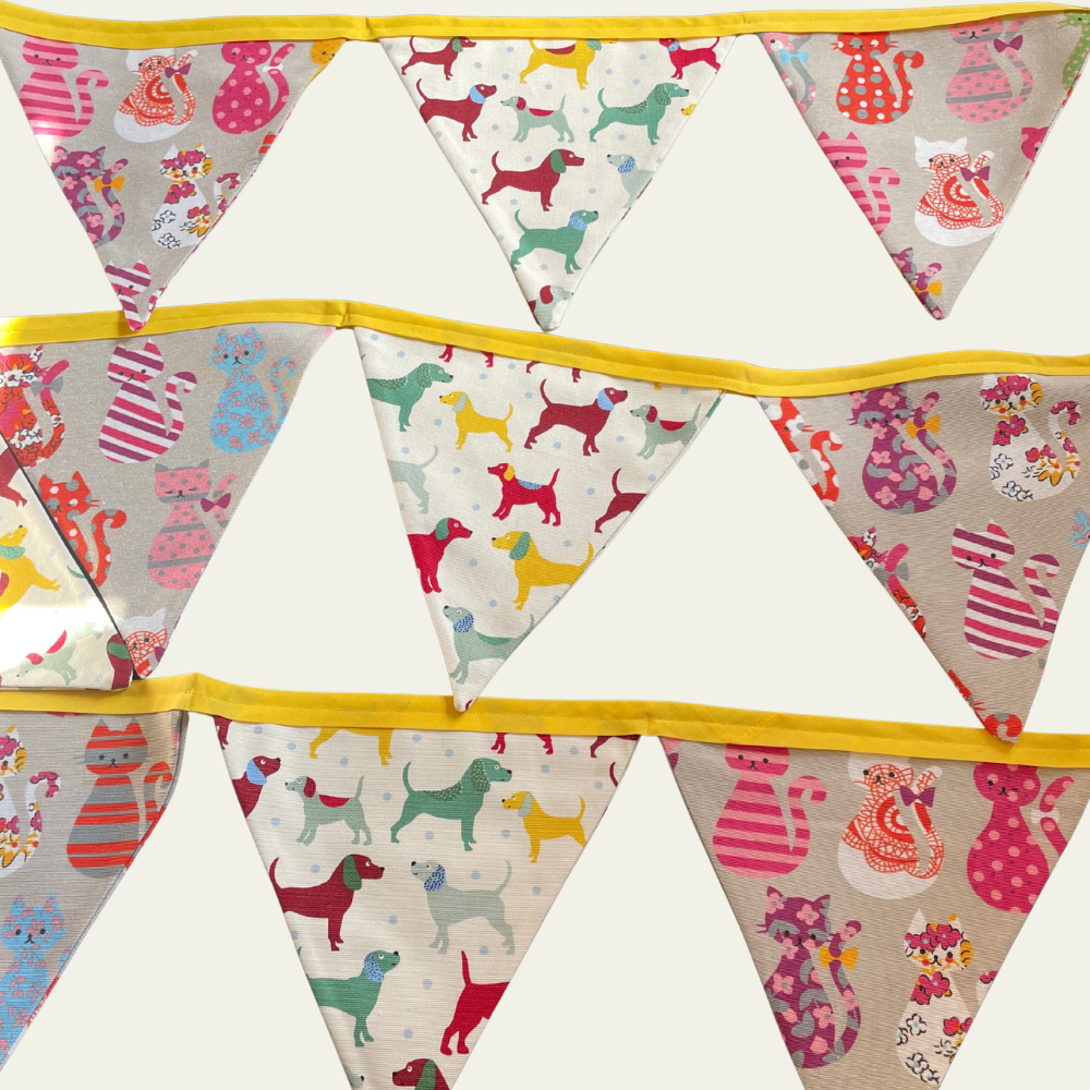 Bunting with colourful dog and cat patterns on a white background