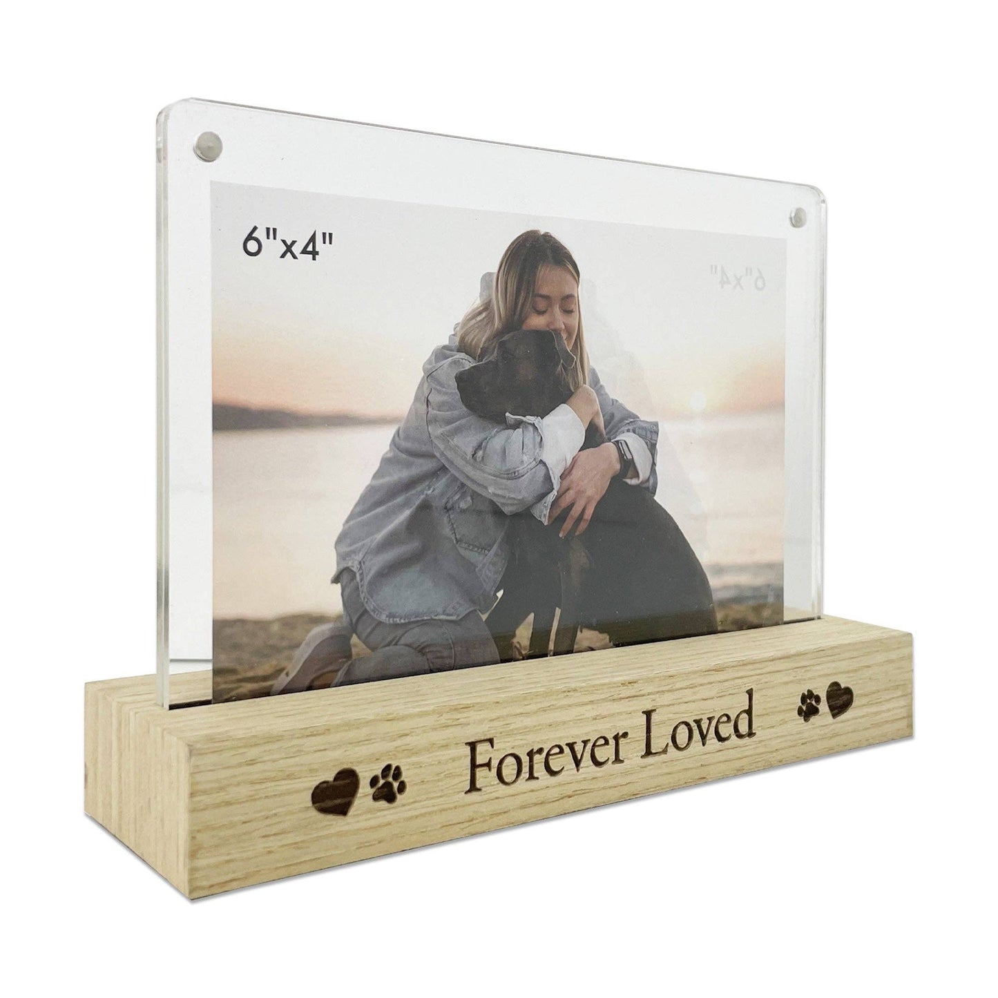 Photo frame with a wooden base and 'Forever Loved' engraving, holding a picture of a woman and dog.