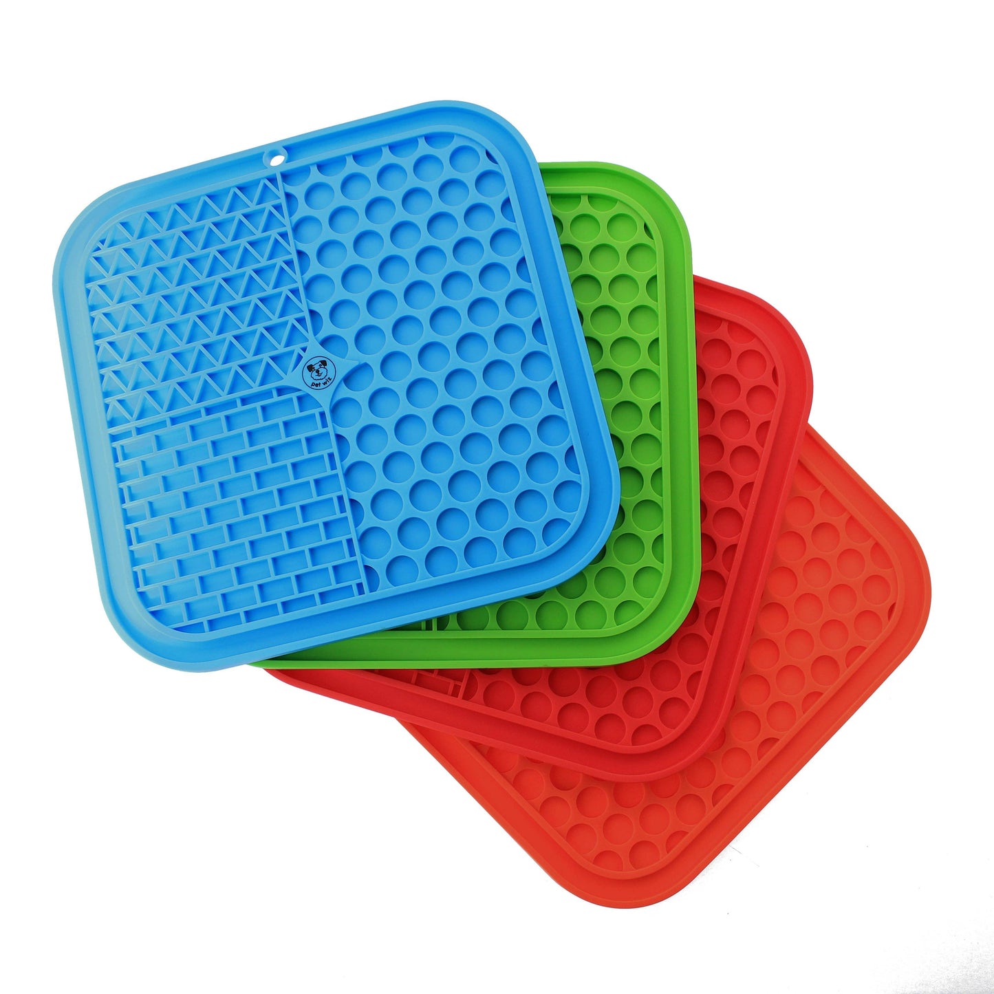 Three colorful silicone mats in blue, green, and red on a white background