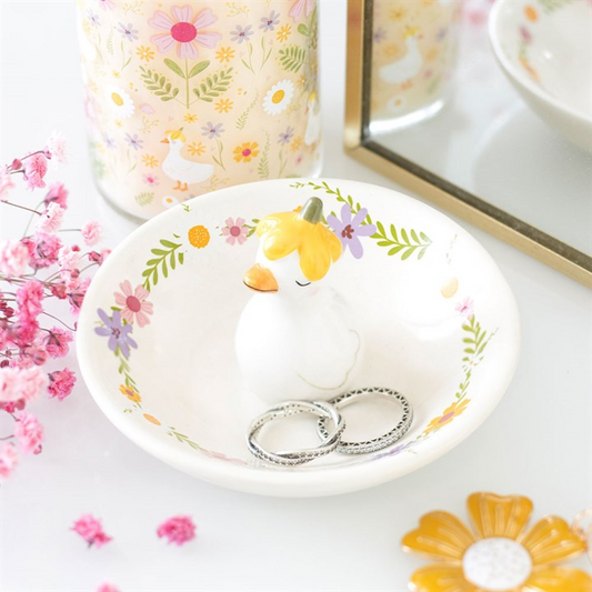 Decorative ring dish with a cartoon duck design on a floral background