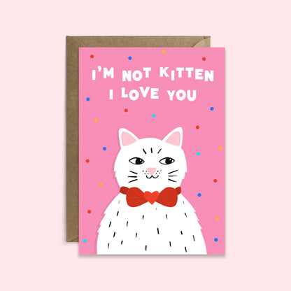 Greeting card with a cat illustration and text on a pink background