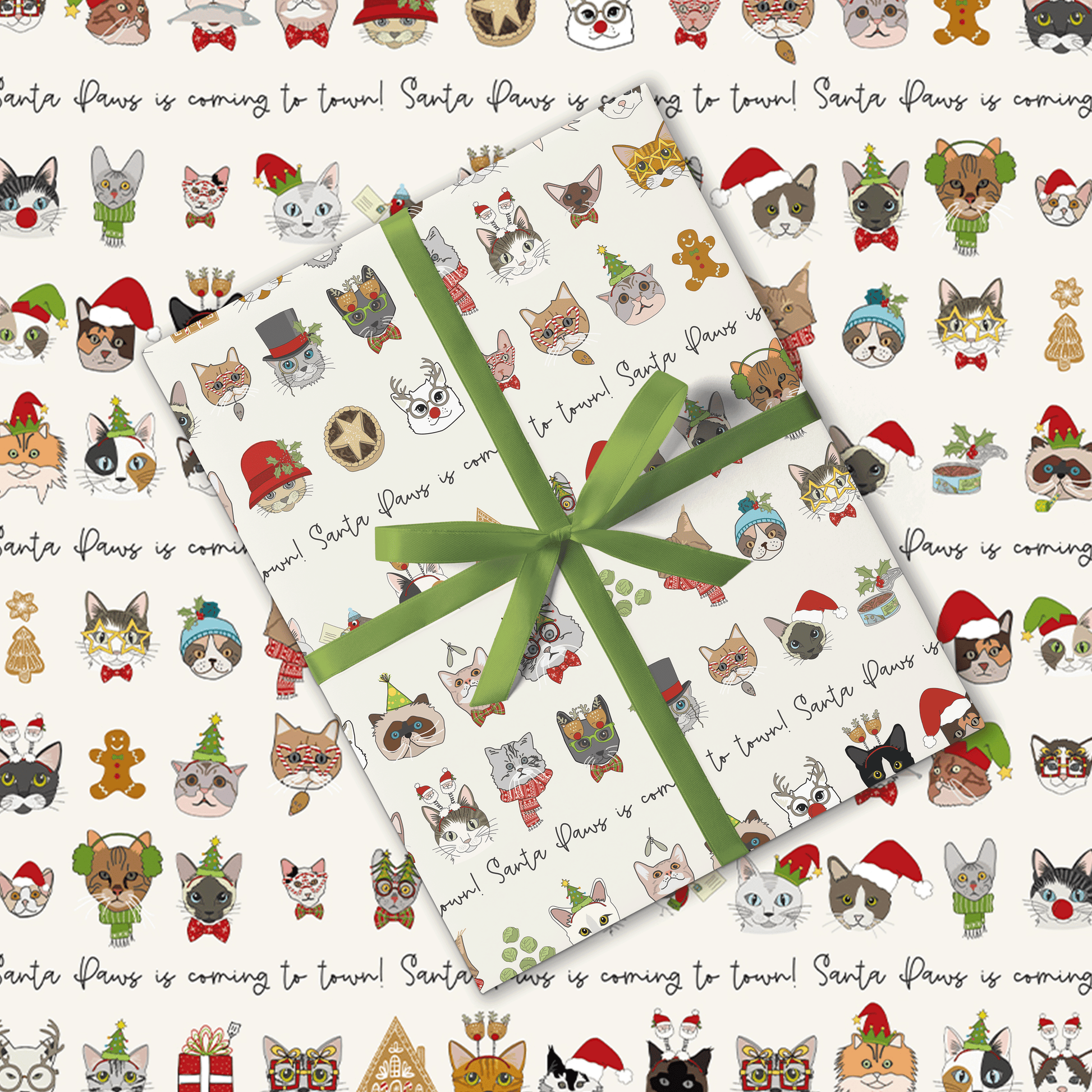 Gift wrap with Christmas-themed cat illustrations and a green ribbon.