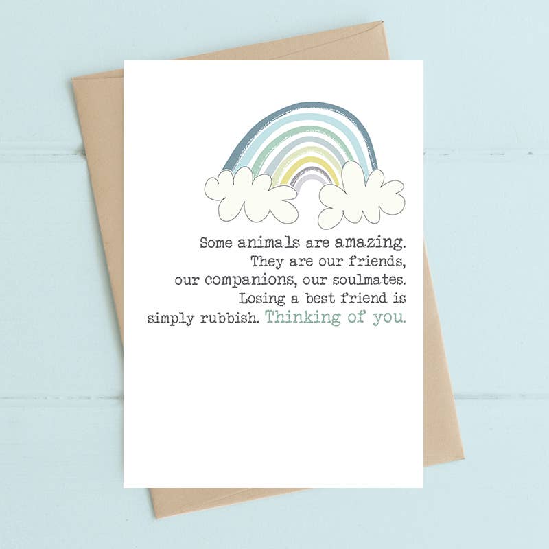 Greeting card with rainbow and text on a light blue background