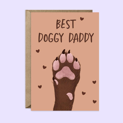Card with 'Best Doggy Daddy' text and a paw print on a light purple background