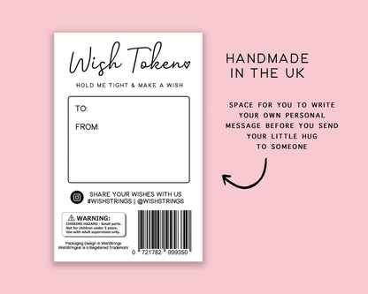 Wish Token packaging with text on a pink background