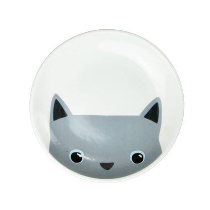 Round white dish with a grey cat face design on a white background