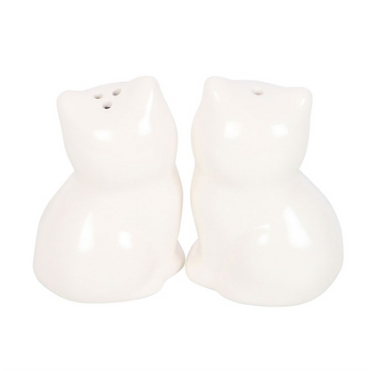 Two white ceramic cat-shaped salt and pepper shakers on a white background
