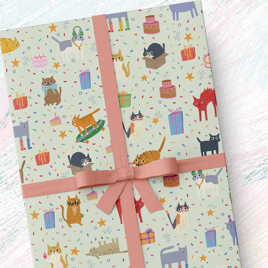 Gift wrap with cat and gift pattern tied with a pink ribbon on a light background