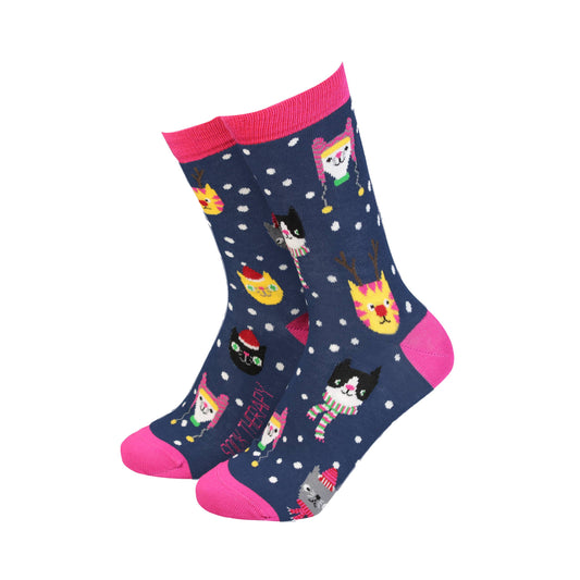 Navy blue socks with colorful cat pattern and pink accents on a white background