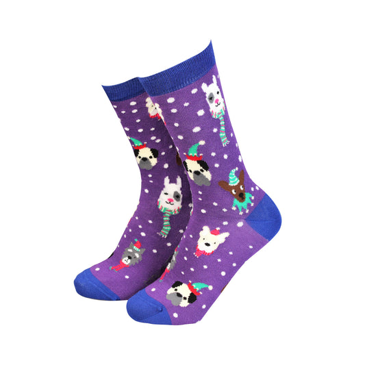 Purple socks with dog illustrations on a white background