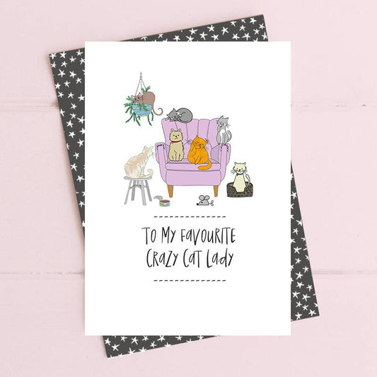 Greeting card with cat illustrations and text on a pink background