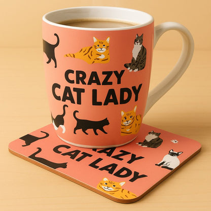 Ceramic mug with 'Crazy Cat Lady' design on a matching coaster, filled with a beverage.