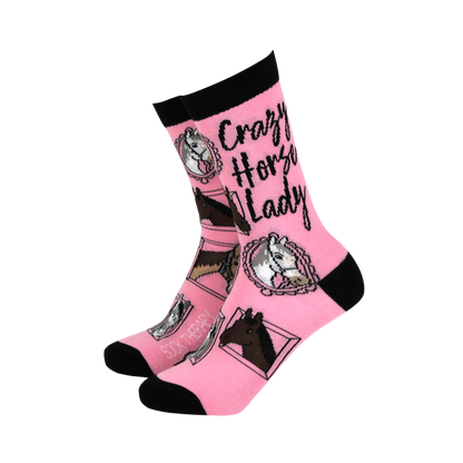 Pink socks with horse designs and text on a white background