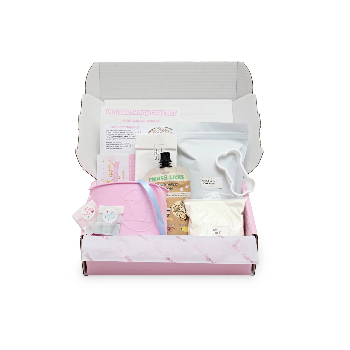 Gift box with dog birthday cake products on a white background