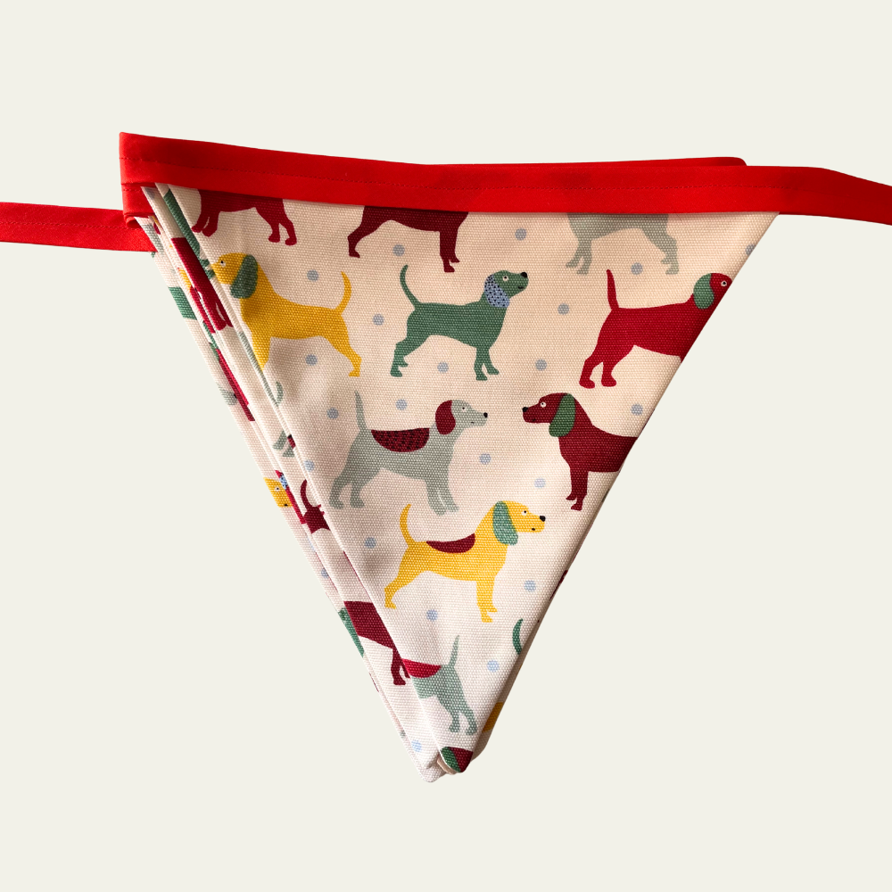 Bunting with colourful dog pattern on a white background