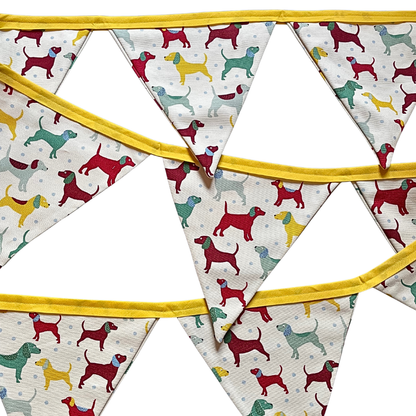 Fabric bunting with a dog pattern material and yellow binding. 
