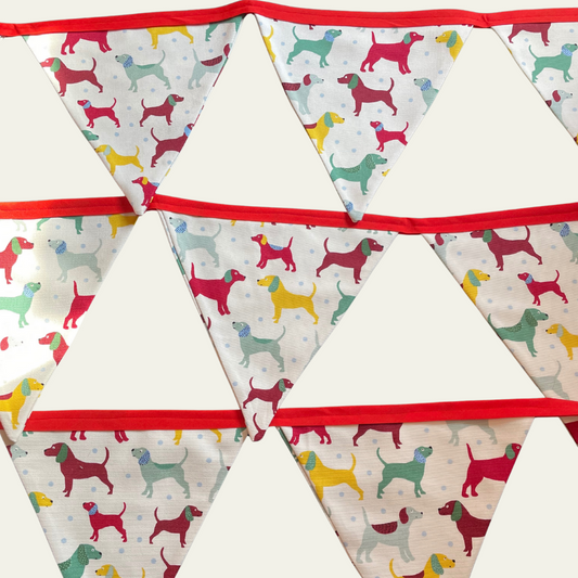 Bunting with colourful dog pattern on a white background