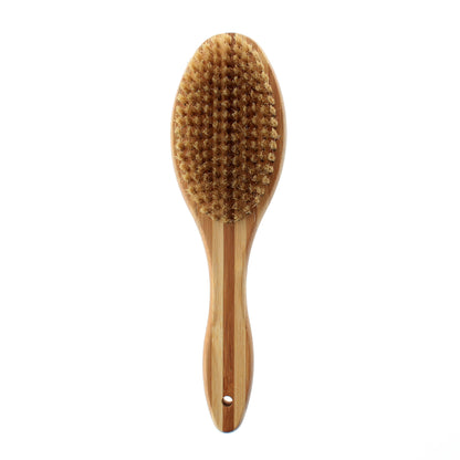 Wooden dog brush with bristles on a white background