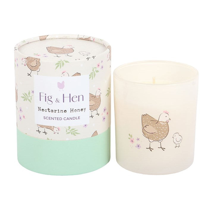 Scented candle with 'Fig & Hen' branding and a chicken design on a white background