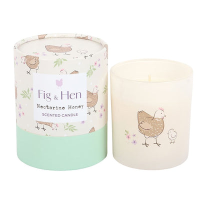 Scented candle with 'Fig & Hen' branding and a chicken design on a white background