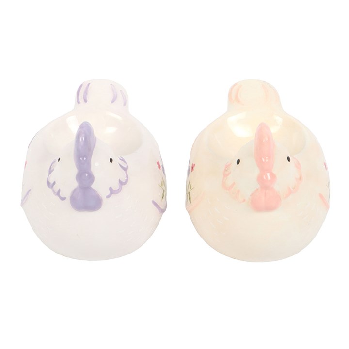 Two small ceramic hen egg cups facing forward on a white background