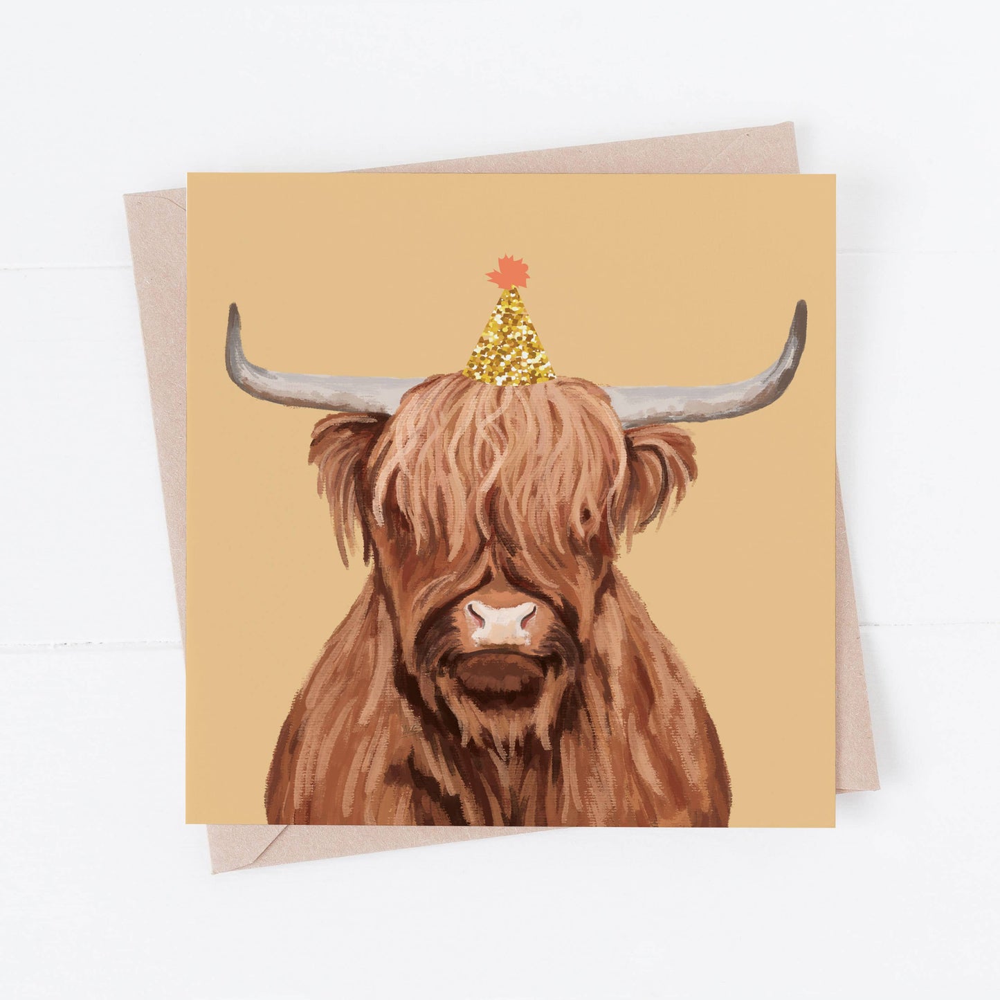 Greeting card with a highland cow illustration on a beige background