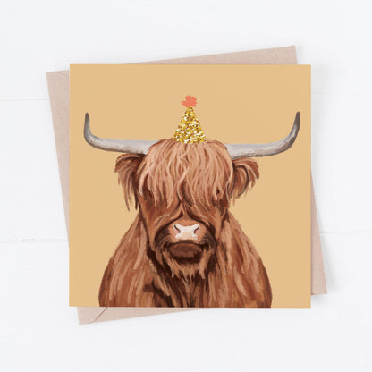Greeting card with a highland cow illustration on a beige background