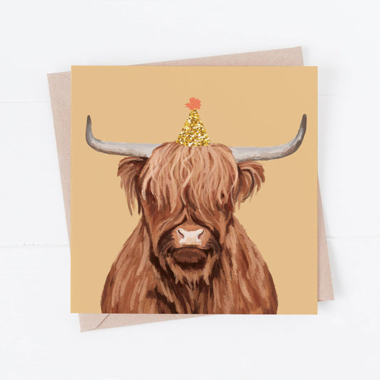Greeting card with a highland cow illustration on a beige background