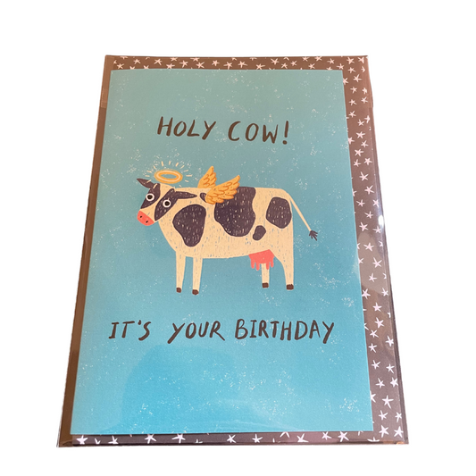 Birthday card with a cow illustration and text on a blue background
