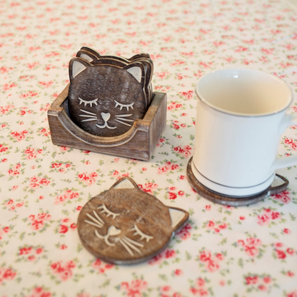 Cat coaster set with a mug on one of the coasters.