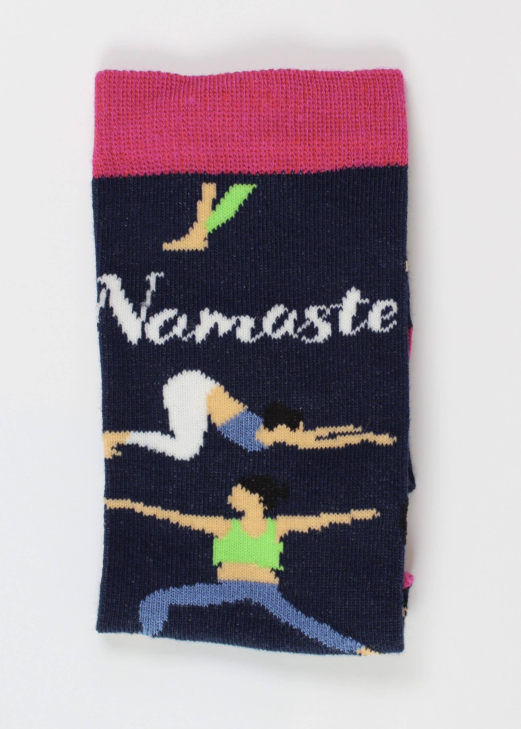 navy socks with pink rim, design of women doing yoga and slogan namaste displayed. 