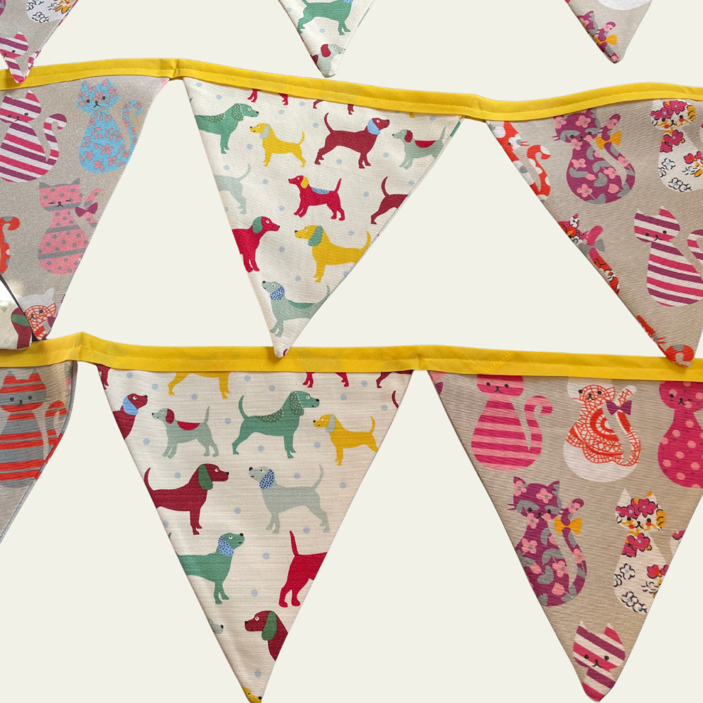 Bunting with colourful dog and cat patterns on a white background