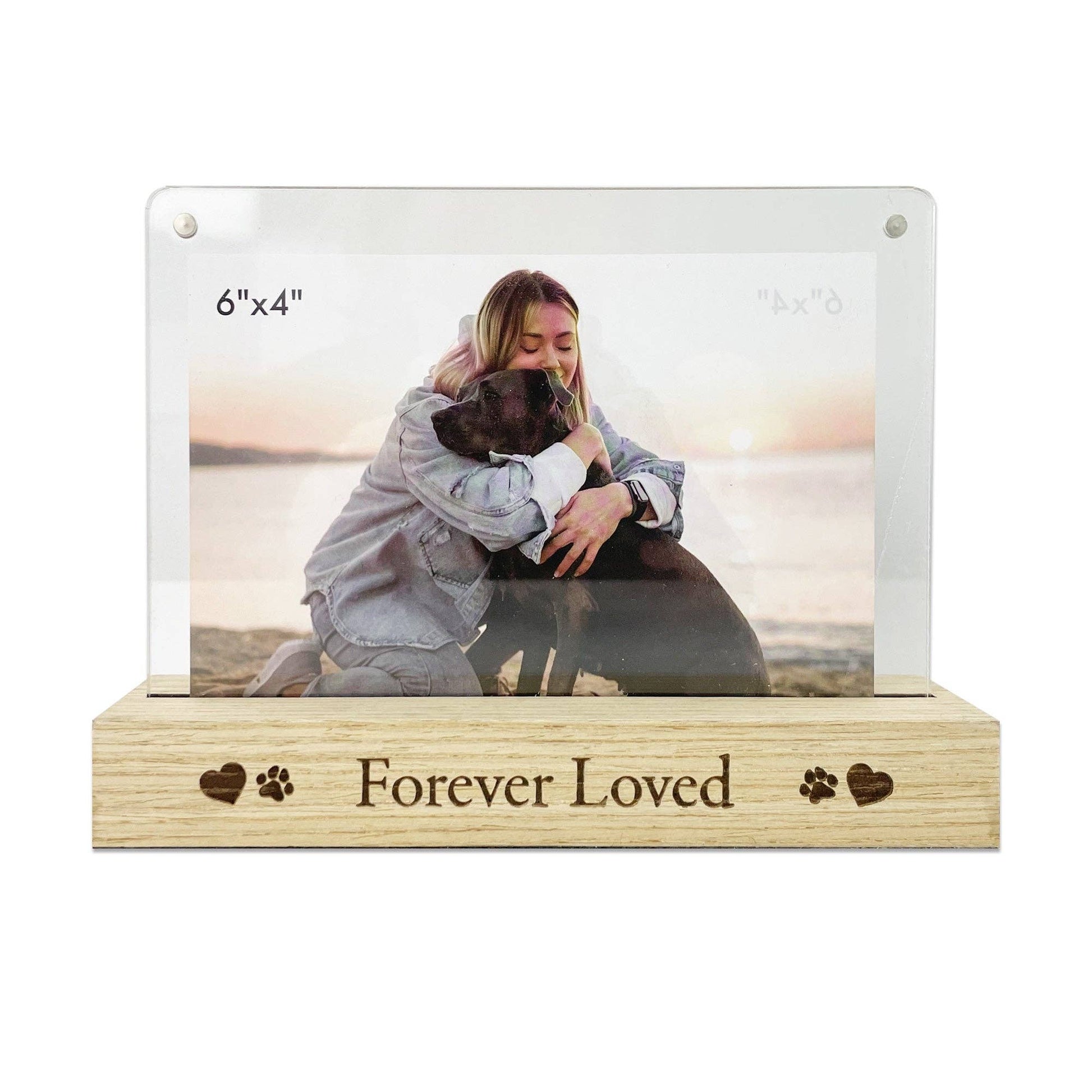 Acrylic photo frame with wooden base displaying a photo of a woman and dog, with 'Forever Loved' engraving.