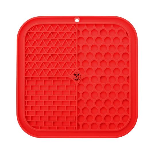 Red silicone pet licking mat on a white background