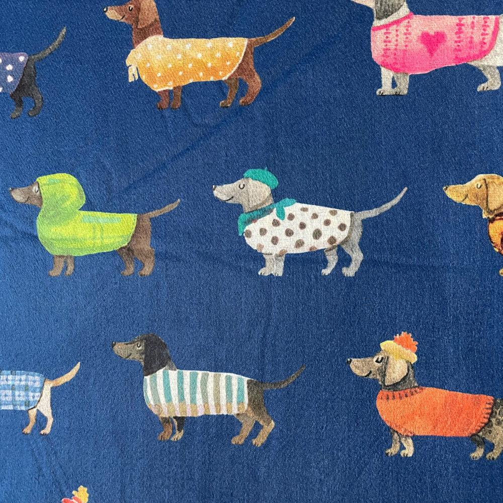 Close up of navy scarf showing the sausage dogs in coats 