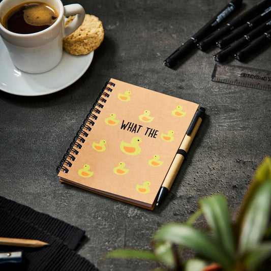 a notepad and pen set saying 'what the duck' with images of yellow ducks printed over the front cover.