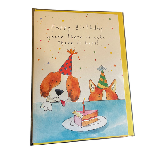 Birthday card with cartoon dogs and a cake, featuring the text 'Happy Birthday where there is cake there is hope'.