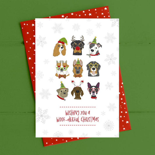 Christmas card with cartoon dogs and festive text on a green background